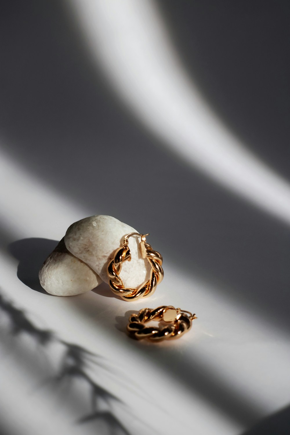 Temporary close detail of sculptural earrings; replace with Wendy's hands, materials or finished work.